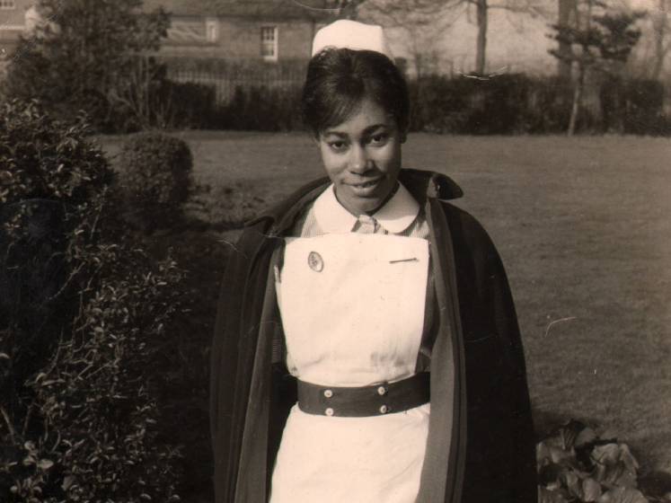 A black and white photo of Dawn Hill in her nurses uniform.